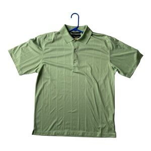 Greg Norman Play Dry Polo Short Sleeve Golf Shirt. Size Medium